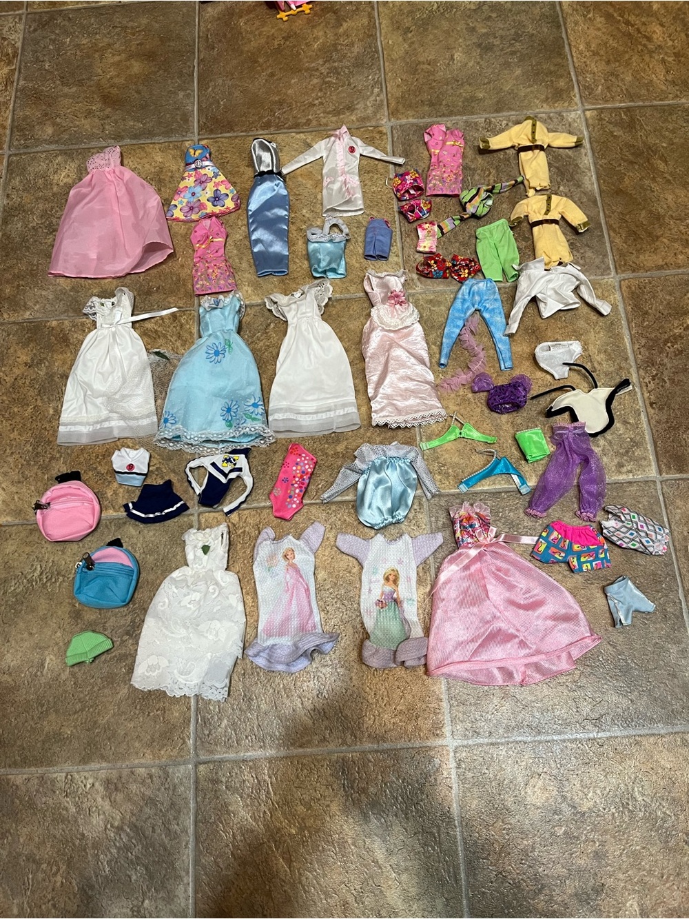 Lot Of 46 Barbie Clothes - 46 pieces.